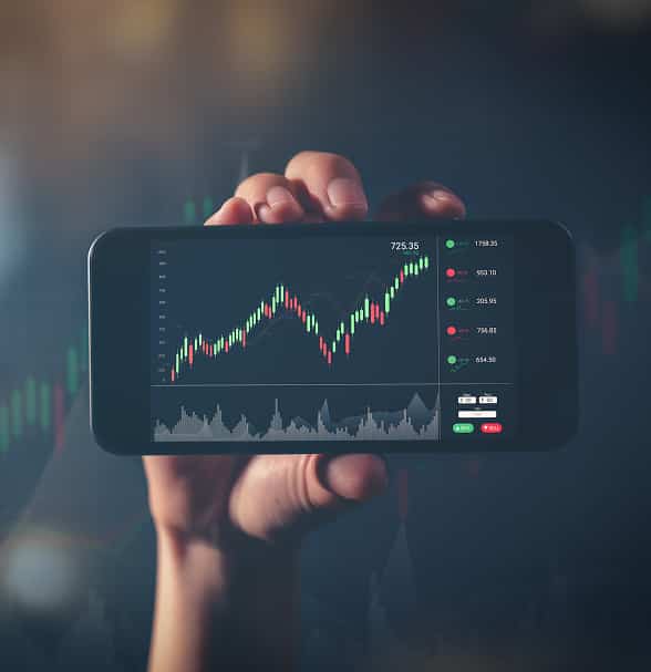 Hand holding a device with live trading charts and Verdifjord market monitoring interface